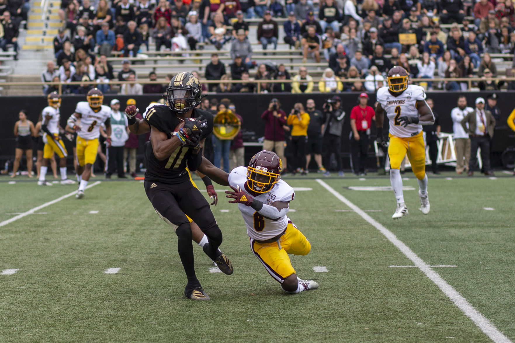 Sophomore receiver Jaylen Hall evades his man for a completion